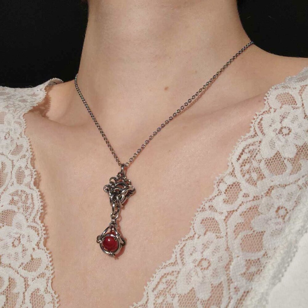 Antique style red pearl diamond-shaped pendant on a small silver chain necklace